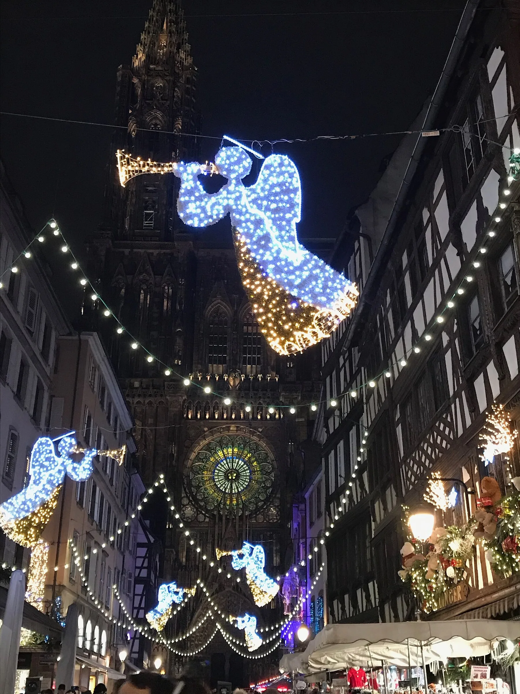 A street and Strasbourg Cathedral during the Christmas festivities.