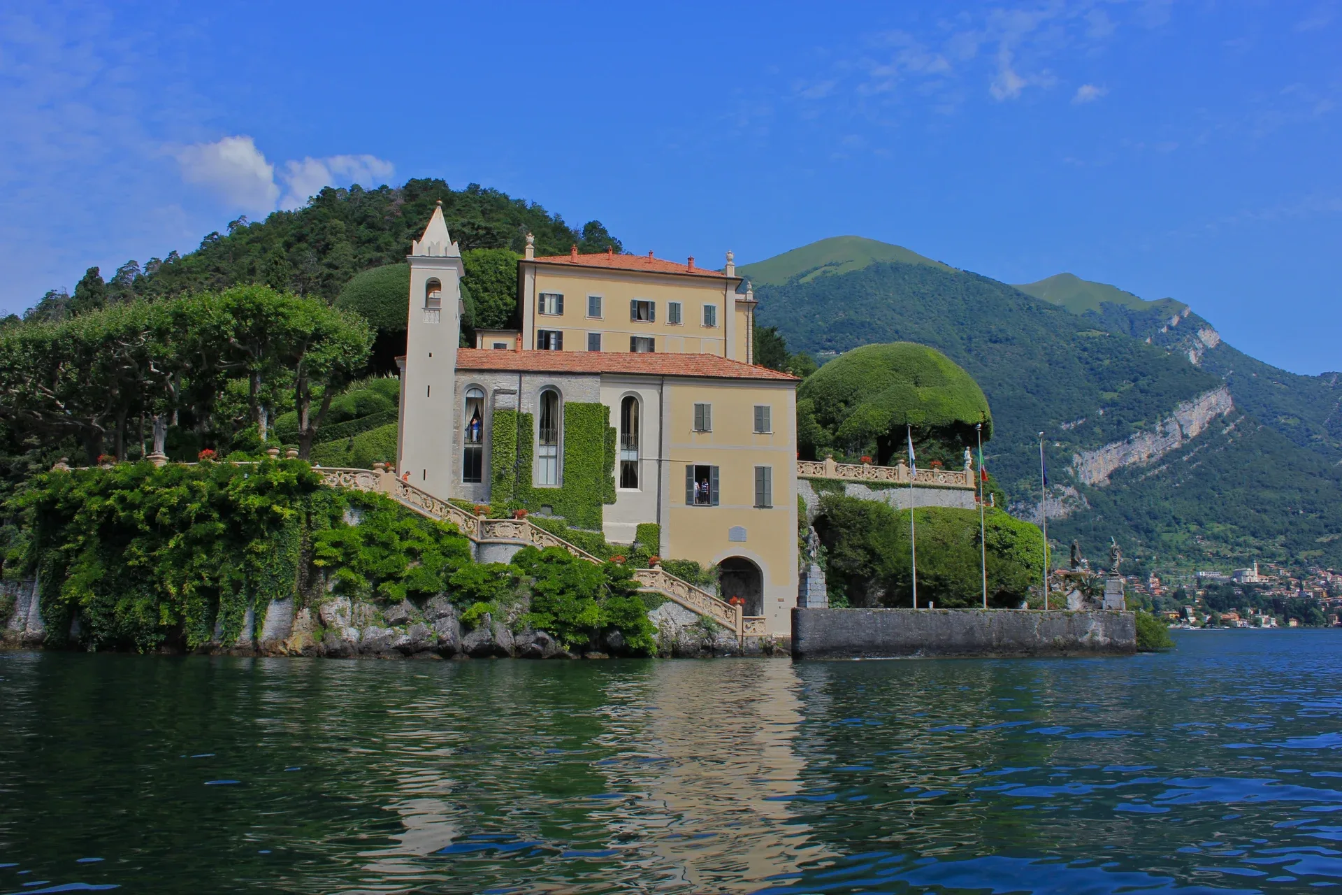 Villa del Balbianello’s buildings, terraces and staircase, seen from the water.